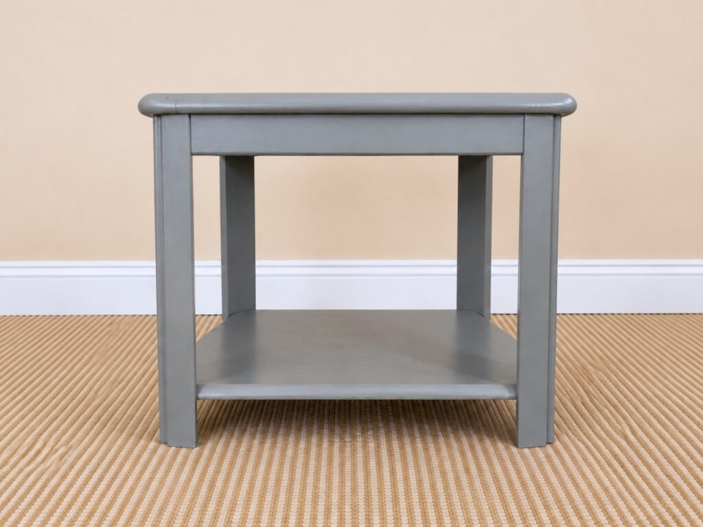 Refinished Chelsea Gray end table with lower shelf styled in a warm neutral living room.